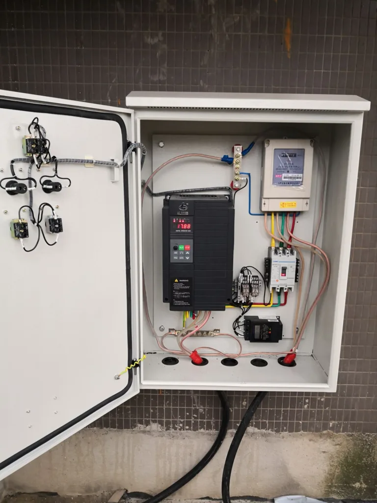 Industrial VFD control panel with labeled components inside an electrical cabinet
